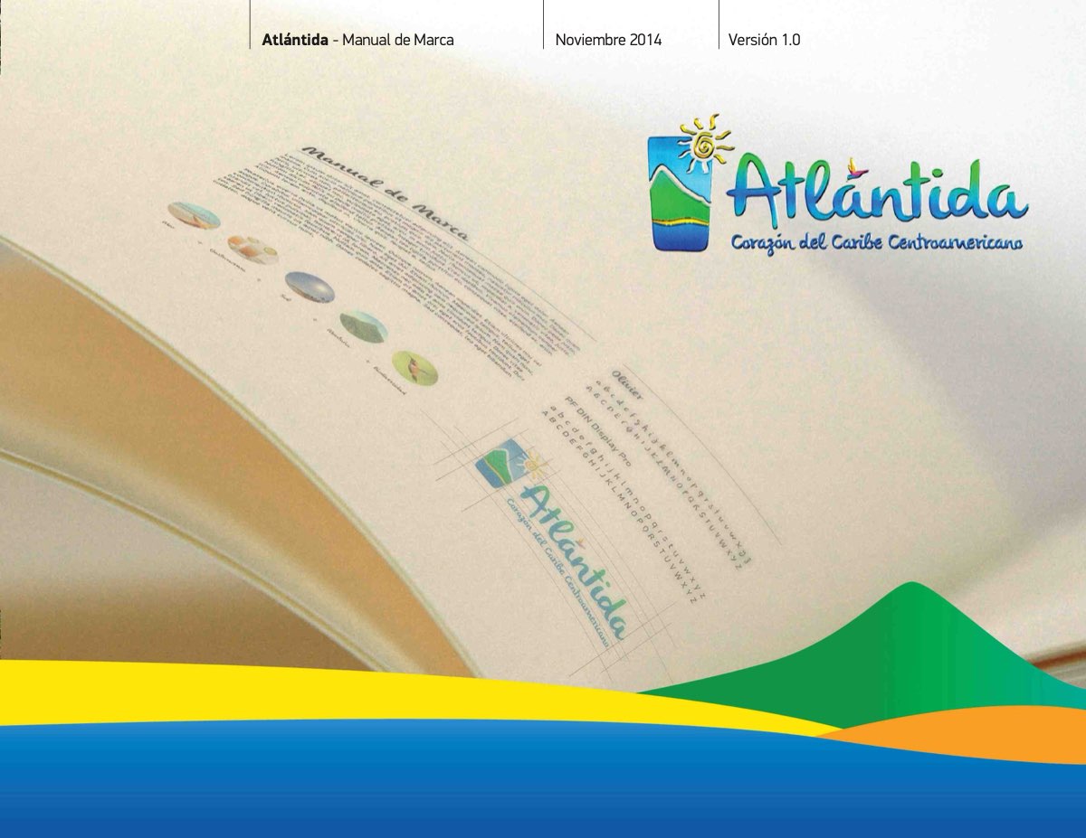 The cover of the Atlántida brand manual, November 2014: the logo, a sun over green hills and the line “Corazón del Caribe Centroamericano”, over a photograph of the manual's pages.